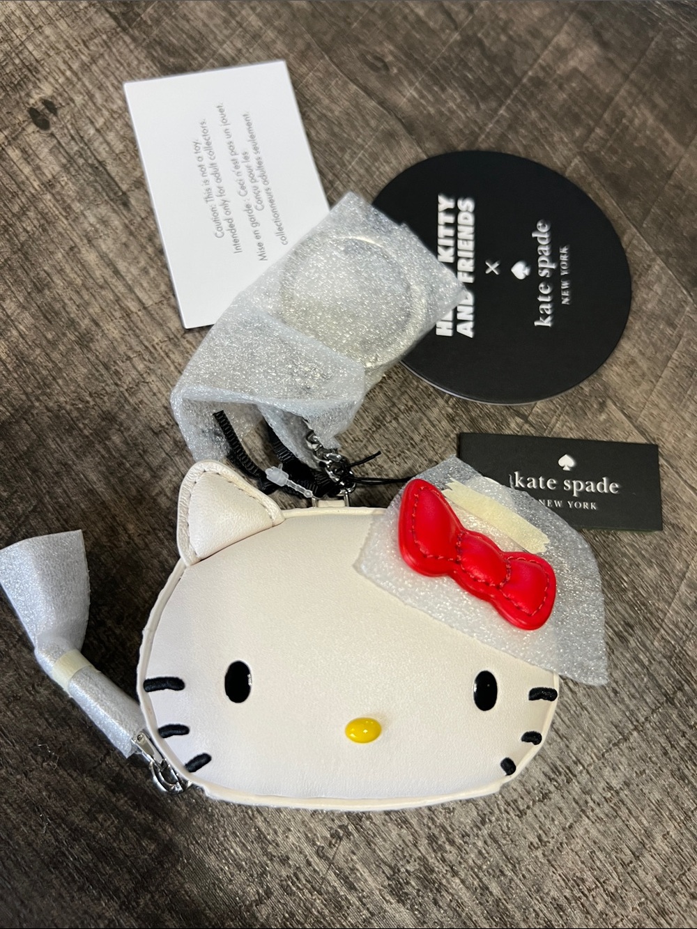 kate spade White Hello Kitty Coin Purse with Red Bow